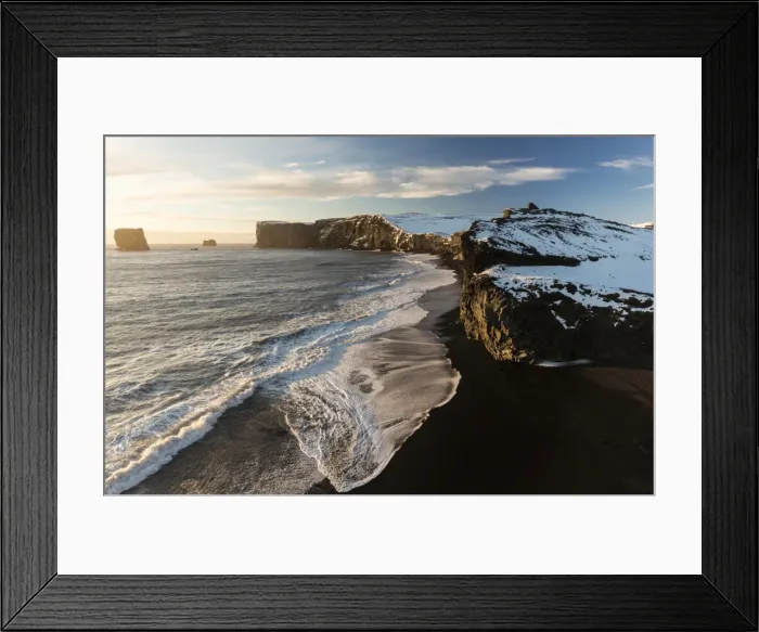 Framed Print : Winter view towards snow covered headland at Dyrholaey bathed in evening sunlight Framed Print : Winter view towards snow covered headland at Dyrholaey bathed in evening sunlight