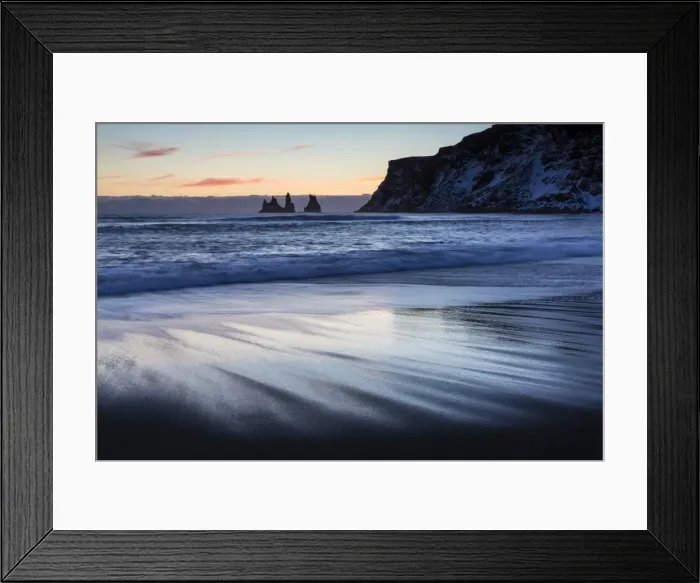 Framed Print : Winter sunset on black volcanic sand beach looking towards rock stacks of Reynisdrangar Framed Print : Winter sunset on black volcanic sand beach looking towards rock stacks of Reynisdrangar
