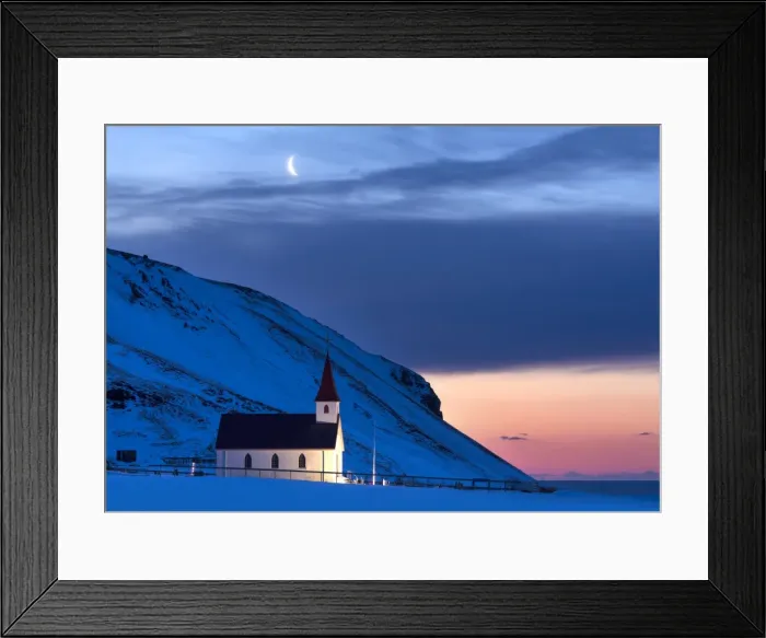 Framed Print : Floodlit church at dawn against snow covered mountains, winter, near Vik, South Iceland Framed Print : Floodlit church at dawn against snow covered mountains, winter, near Vik, South Iceland