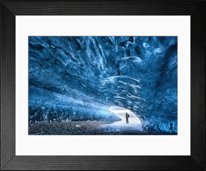Framed Print : View from inside ice cave under the Vatnajokull Glacier with person for scale, near Framed Print : View from inside ice cave under the Vatnajokull Glacier with person for scale, near