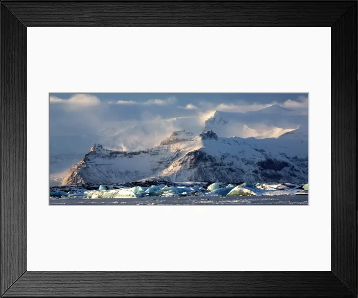 Framed Print : Winter view over frozen Jokulsarlon Glacier Lagoon showing blue icebergs covered in snow Framed Print : Winter view over frozen Jokulsarlon Glacier Lagoon showing blue icebergs covered in snow