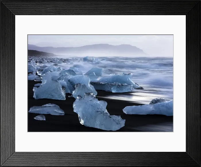 Framed Print : Glacial icebergs washed up from North Atlantic Ocean onto volcanic sand beach near Jokulsarlon Framed Print : Glacial icebergs washed up from North Atlantic Ocean onto volcanic sand beach near Jokulsarlon