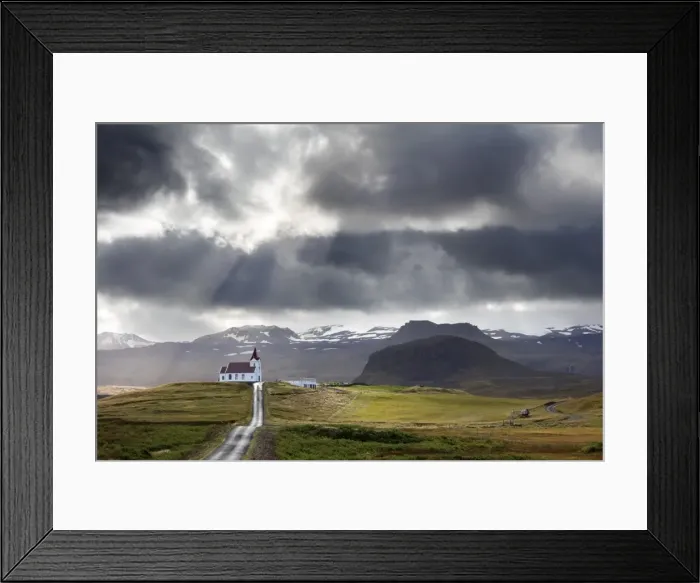 Framed Print : Ingjaldsholskirkja set against mountains on a dramatic stormy day, near Rif, Snaefellsnes Peninsula Framed Print : Ingjaldsholskirkja set against mountains on a dramatic stormy day, near Rif, Snaefellsnes Peninsula
