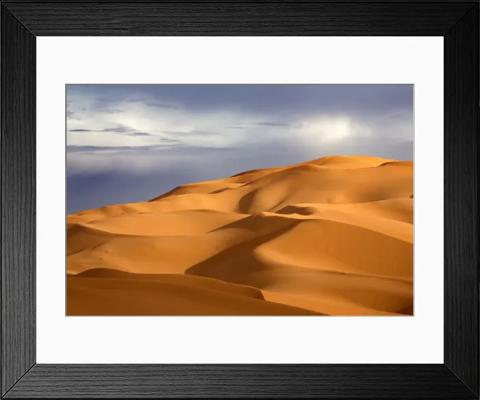 Framed Print : Orange sand dunes against stormy sky, Erg Chebbi sand sea, part of the Sahara Desert near Merzouga Framed Print : Orange sand dunes against stormy sky, Erg Chebbi sand sea, part of the Sahara Desert near Merzouga