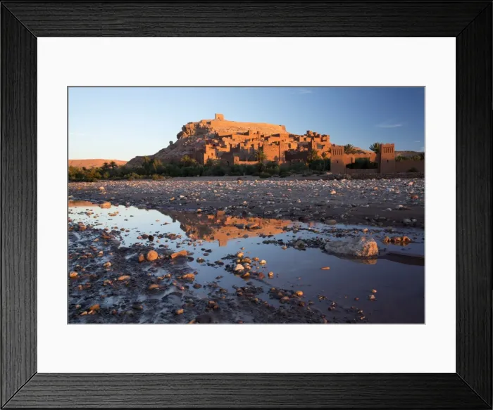 Framed Print : The ancient Kasbah Ait Benhaddou bathed in morning light and reflecting in river Framed Print : The ancient Kasbah Ait Benhaddou bathed in morning light and reflecting in river
