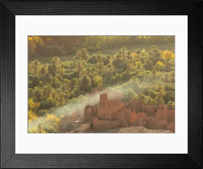 Framed Print : Ruined kasbah in the palmerie near Tinerhir, with smoke from fire swirling through the palm trees Framed Print : Ruined kasbah in the palmerie near Tinerhir, with smoke from fire swirling through the palm trees
