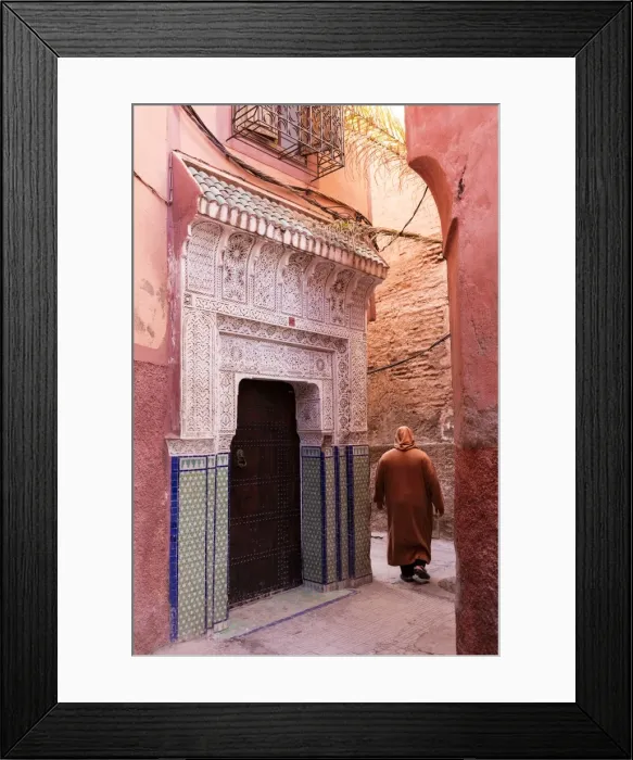 Framed Print : Local man dressed in traditional djellaba walking through street in the Kasbah, Marrakech Framed Print : Local man dressed in traditional djellaba walking through street in the Kasbah, Marrakech