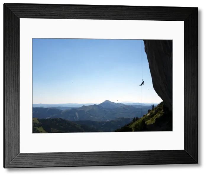 Framed Print : A climber ascends a rope on the cliffs of Ceuse, a mountain in the Alpes Maritimes Framed Print : A climber ascends a rope on the cliffs of Ceuse, a mountain in the Alpes Maritimes