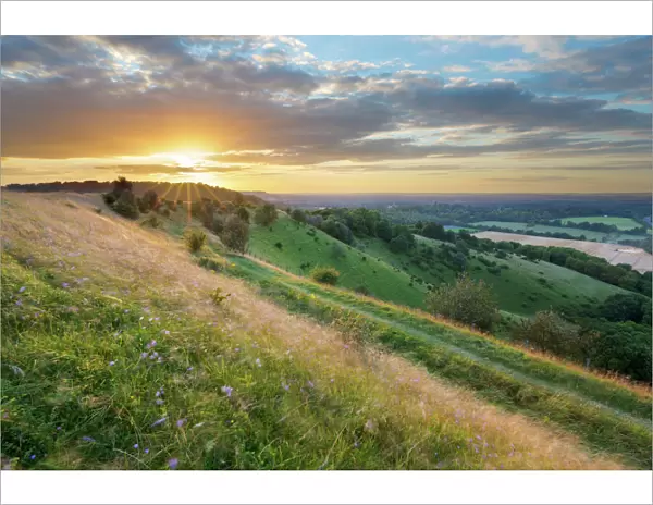 Sunset over Iron-Age hill fort of Beacon Hill, near Highclere, Hampshire, England