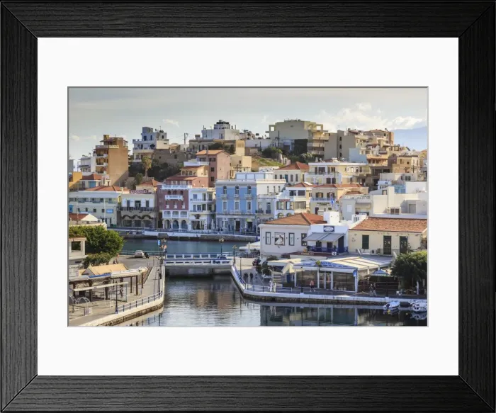 Framed Print : Voulismeni Lake, pedestrianised lakeside with cafes and Agios Nikolaos town, Lasithi Framed Print : Voulismeni Lake, pedestrianised lakeside with cafes and Agios Nikolaos town, Lasithi