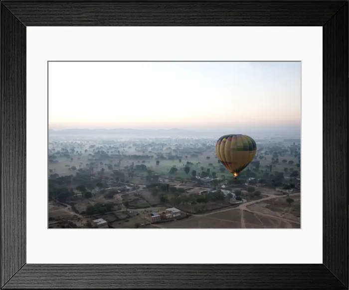 Framed Print : Hot air balloon in the early morning, flying over countryside and the village of Samode Framed Print : Hot air balloon in the early morning, flying over countryside and the village of Samode