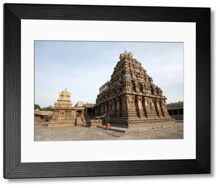 Framed Print : Woman in orange sari sitting beside the vimala section of Swaminathaswamy temple Framed Print : Woman in orange sari sitting beside the vimala section of Swaminathaswamy temple