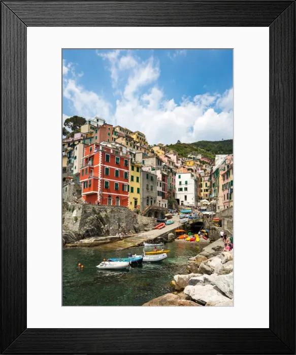 Framed Print : The colourful buildings and boats in Riomaggiore harbour, Cinque Terre, UNESCO World Heritage Site Framed Print : The colourful buildings and boats in Riomaggiore harbour, Cinque Terre, UNESCO World Heritage Site