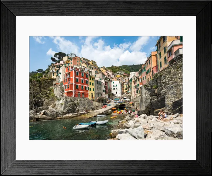 Framed Print : The colourful buildings and boats in Riomaggiore harbour, Cinque Terre, UNESCO World Heritage Site Framed Print : The colourful buildings and boats in Riomaggiore harbour, Cinque Terre, UNESCO World Heritage Site