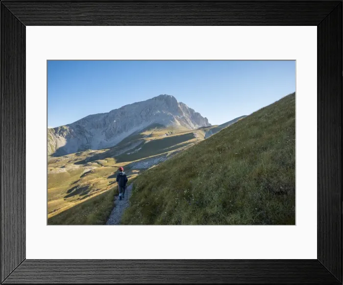 Framed Print : Hiker on the path to the summit of peak Corno Grande, Gran Sasso e Monti della Laga National Park Framed Print : Hiker on the path to the summit of peak Corno Grande, Gran Sasso e Monti della Laga National Park