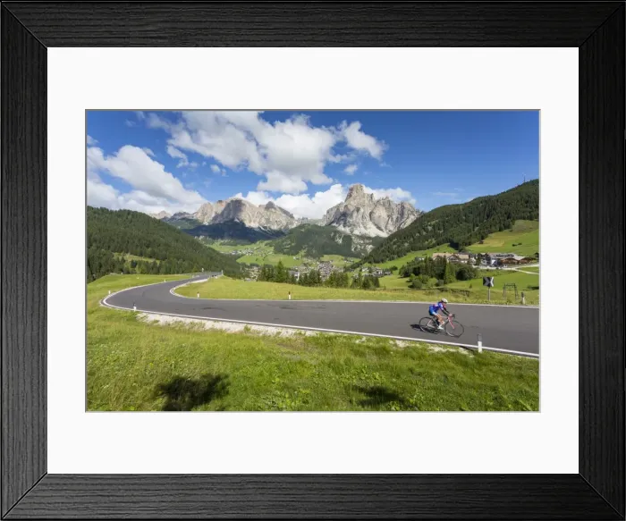 Framed Print : View toward Corvara and road cyclist, Alta Badia, Corvara, Dolomites, South Tyrol Framed Print : View toward Corvara and road cyclist, Alta Badia, Corvara, Dolomites, South Tyrol