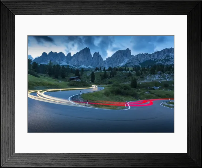 Framed Print : Car trail lights on Passo Pordoi with mountain backdrop at dusk, Province of Bolzano Framed Print : Car trail lights on Passo Pordoi with mountain backdrop at dusk, Province of Bolzano