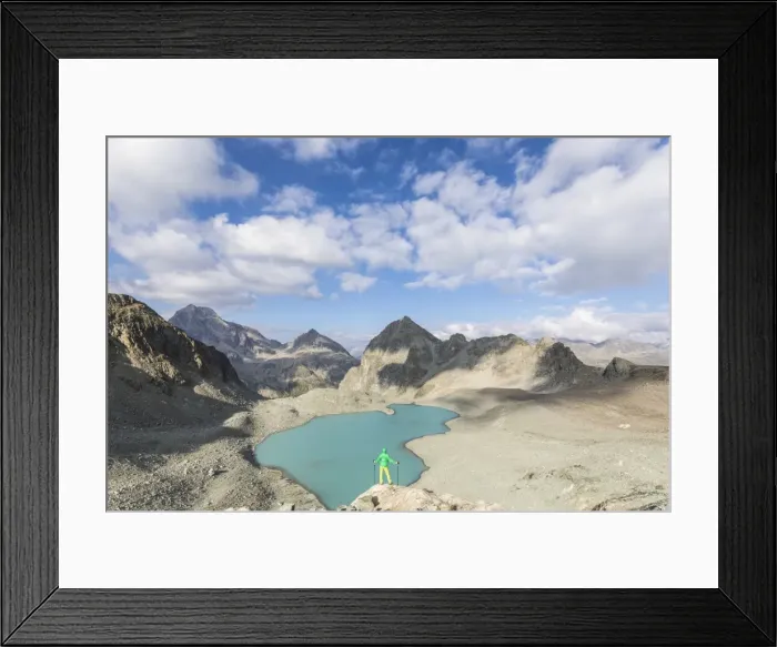 Framed Print : Hiker on the rocks overhanging Lej Lagrev, Silvaplana, Engadine, Canton of Graubunden Framed Print : Hiker on the rocks overhanging Lej Lagrev, Silvaplana, Engadine, Canton of Graubunden