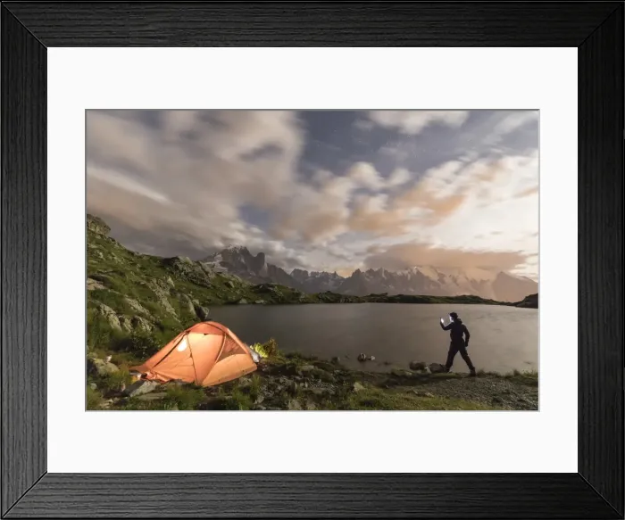 Framed Print : Hiker and tent on the shore of Lacs De Cheserys at night with Mont Blanc massif in background Framed Print : Hiker and tent on the shore of Lacs De Cheserys at night with Mont Blanc massif in background