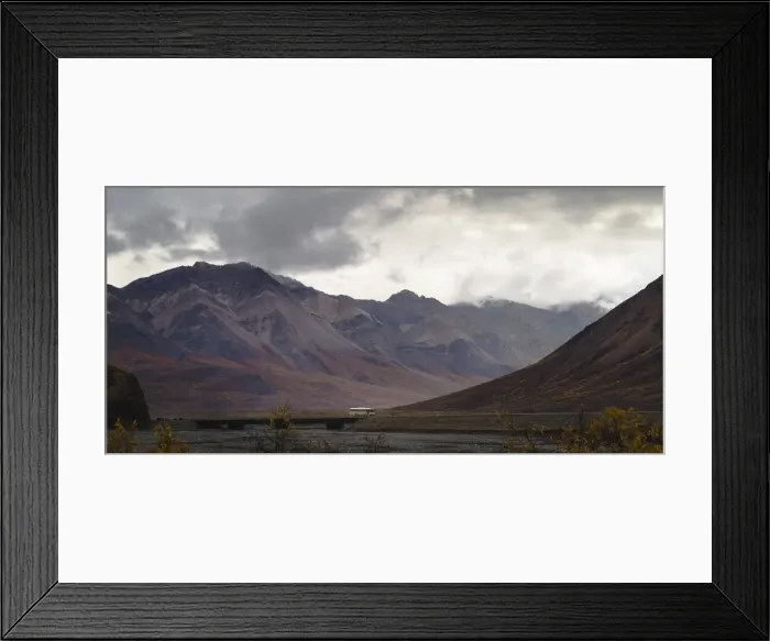 Framed Print : Tourist bus driving among mountains in the Denali National Park, Alaska, United States of America Framed Print : Tourist bus driving among mountains in the Denali National Park, Alaska, United States of America