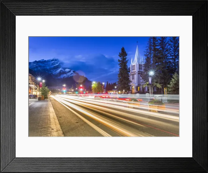 Framed Print : Trail lights on Banff Avenue and St. Pauls Presbyterian Church, Snow Peak visible through clouds Framed Print : Trail lights on Banff Avenue and St. Pauls Presbyterian Church, Snow Peak visible through clouds