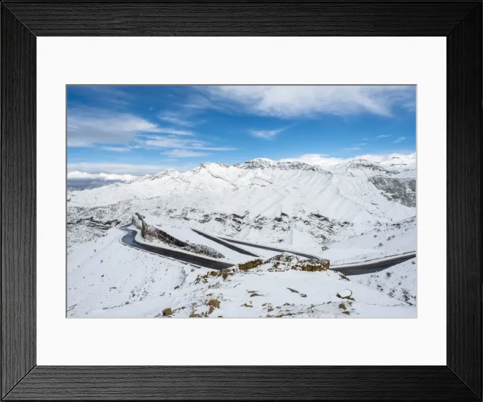 Framed Print : Winding road through Tizi N Tichka pass in the Atlas Mountains during winter snow Framed Print : Winding road through Tizi N Tichka pass in the Atlas Mountains during winter snow