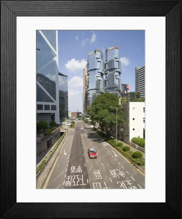 Framed Print : Red taxi cab in Central, Hong Kong Island, with the Bank of China Tower and Lippo Centre beyond Framed Print : Red taxi cab in Central, Hong Kong Island, with the Bank of China Tower and Lippo Centre beyond