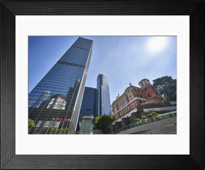 Framed Print : Modern skyscrapers stand next to the colonial Former French Mission Building in Central Framed Print : Modern skyscrapers stand next to the colonial Former French Mission Building in Central