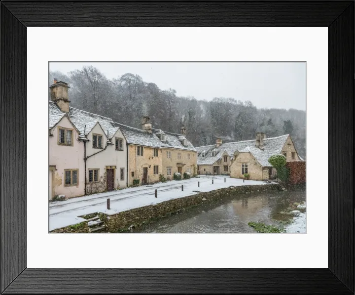 Framed Print : Snow covered houses by By Brook in Castle Combe, Wiltshire, England, United Kingdom Framed Print : Snow covered houses by By Brook in Castle Combe, Wiltshire, England, United Kingdom