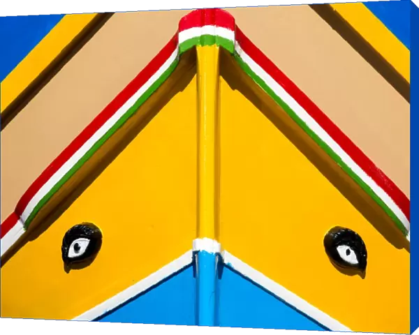 Detail of traditional brightly painted fishing boat in the harbour at Marsaxlokk