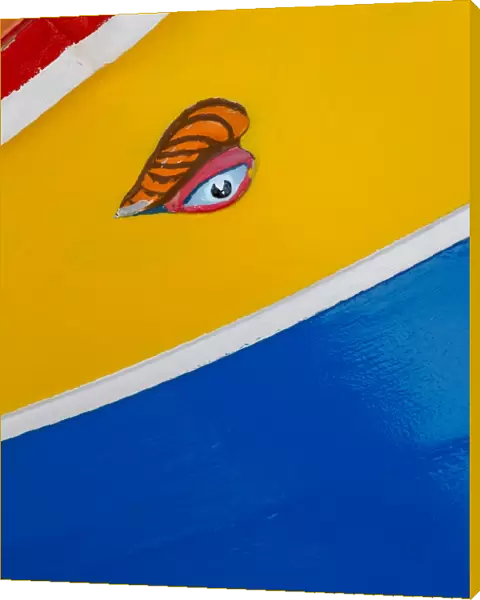 Detail of traditional brightly painted fishing boat in the harbour at Marsaxlokk