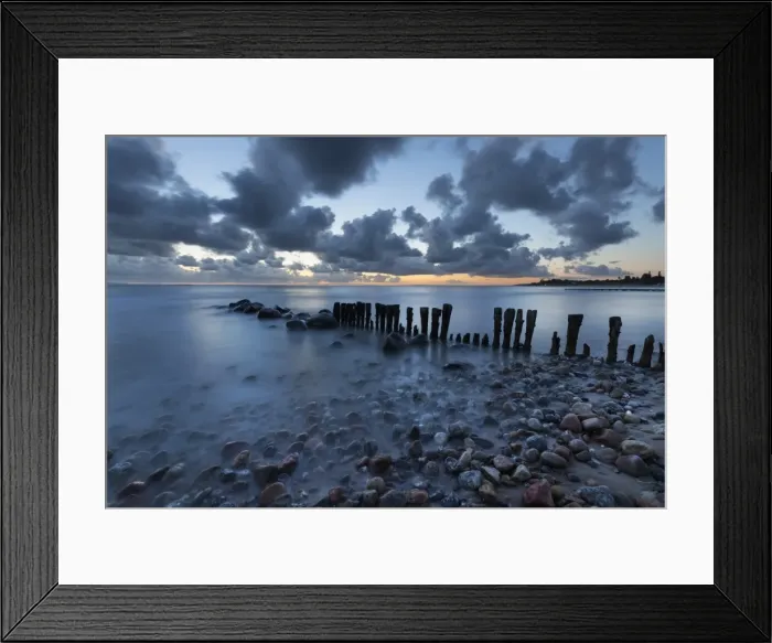 Framed Print : Old wooden piles going out to sea and pebbles on beach at dawn, Munkerup, Kattegat Coast Framed Print : Old wooden piles going out to sea and pebbles on beach at dawn, Munkerup, Kattegat Coast