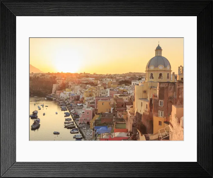 Framed Print : Marina Corricella at sunset, fishing village, colourful fishermens houses, boats and church Framed Print : Marina Corricella at sunset, fishing village, colourful fishermens houses, boats and church