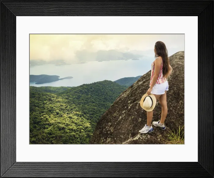 Framed Print : Young woman looking out over the Green Coast (Costa Verde) from Papapagaio peak Framed Print : Young woman looking out over the Green Coast (Costa Verde) from Papapagaio peak