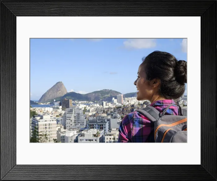 Framed Print : Young backpacker on her mobile phone in central Rio de Janeiro with the Sugar Loaf in the distance Framed Print : Young backpacker on her mobile phone in central Rio de Janeiro with the Sugar Loaf in the distance