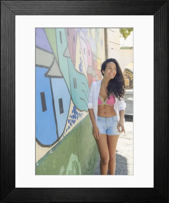 Framed Print : Young Brazilian woman happy and smiling next to a graffiti wall in Lapa, central Rio de Janeiro Framed Print : Young Brazilian woman happy and smiling next to a graffiti wall in Lapa, central Rio de Janeiro