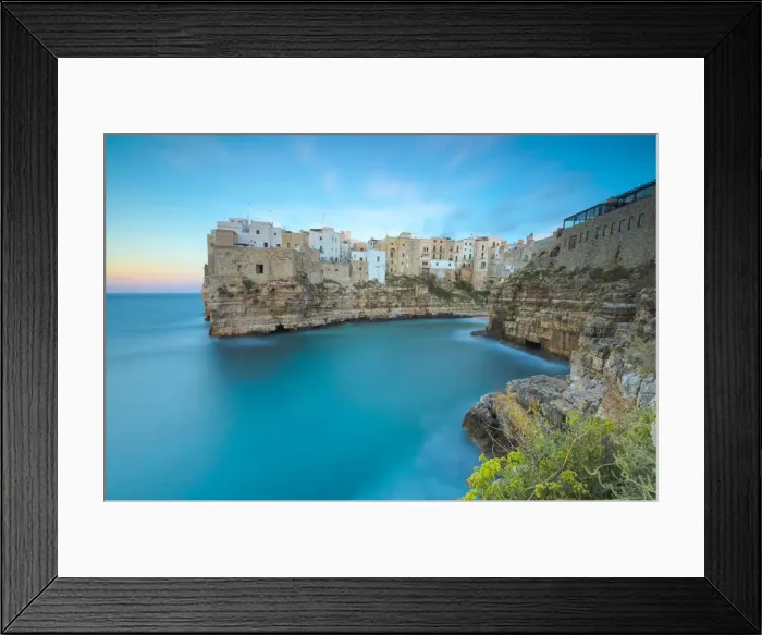 Framed Print : Turquoise sea at sunset framed by the old town perched on the rocks, Polignano a Mare Framed Print : Turquoise sea at sunset framed by the old town perched on the rocks, Polignano a Mare