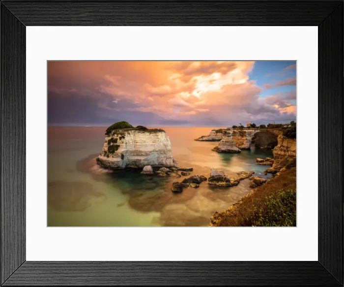 Framed Print : Sunset frames the high cliffs known as Faraglioni di Sant Andrea and the turquoise sea Framed Print : Sunset frames the high cliffs known as Faraglioni di Sant Andrea and the turquoise sea
