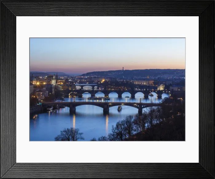 Framed Print : Dusk lights up the historical bridges and buildings reflected on Vltava River, Prague Framed Print : Dusk lights up the historical bridges and buildings reflected on Vltava River, Prague