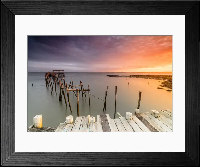 Framed Print : Fiery sky at dawn on the Palafito Pier in the Carrasqueira Natural Reserve of Sado River Framed Print : Fiery sky at dawn on the Palafito Pier in the Carrasqueira Natural Reserve of Sado River