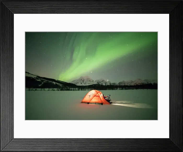 Framed Print : Photographer in a tent lit up by Northern Lights (aurora borealis) and starry sky Framed Print : Photographer in a tent lit up by Northern Lights (aurora borealis) and starry sky