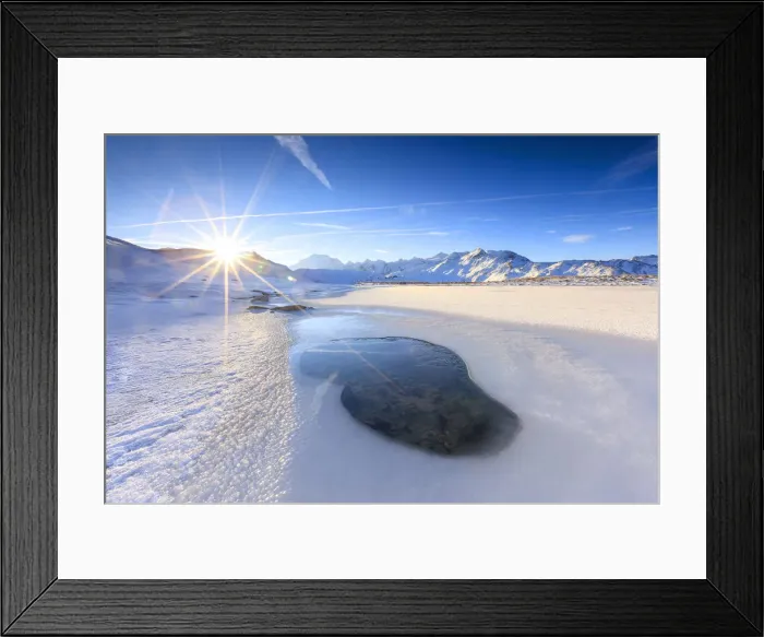 Framed Print : Rays of sun on the frozen Lake, Piz Umbrail framed by Mount Ortles in background Framed Print : Rays of sun on the frozen Lake, Piz Umbrail framed by Mount Ortles in background