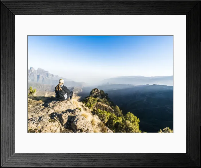 Framed Print : Woman enjoying the early morning sun on the cliffs, Simien Mountains National Park Framed Print : Woman enjoying the early morning sun on the cliffs, Simien Mountains National Park
