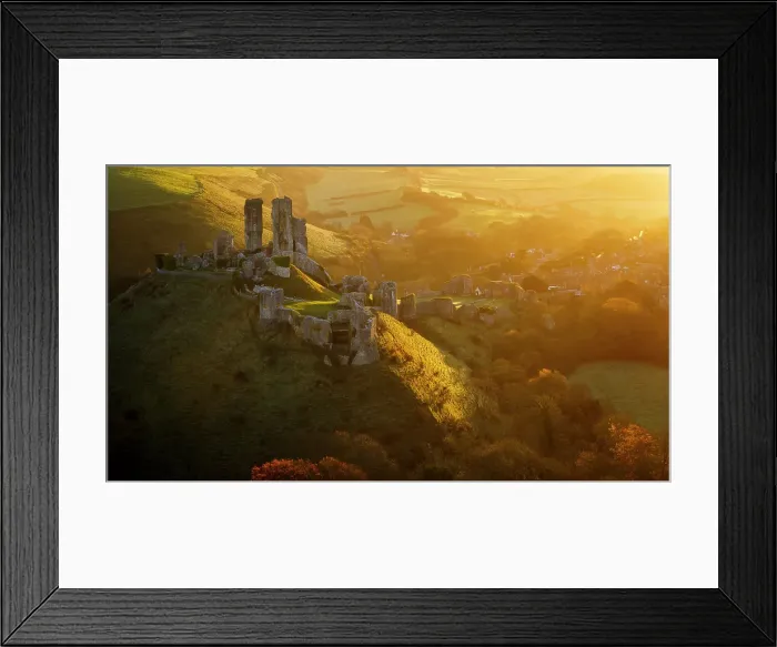 Framed Print : Golden sunrise over the village and castle at Corfe, Dorset, England, United Kingdom Framed Print : Golden sunrise over the village and castle at Corfe, Dorset, England, United Kingdom