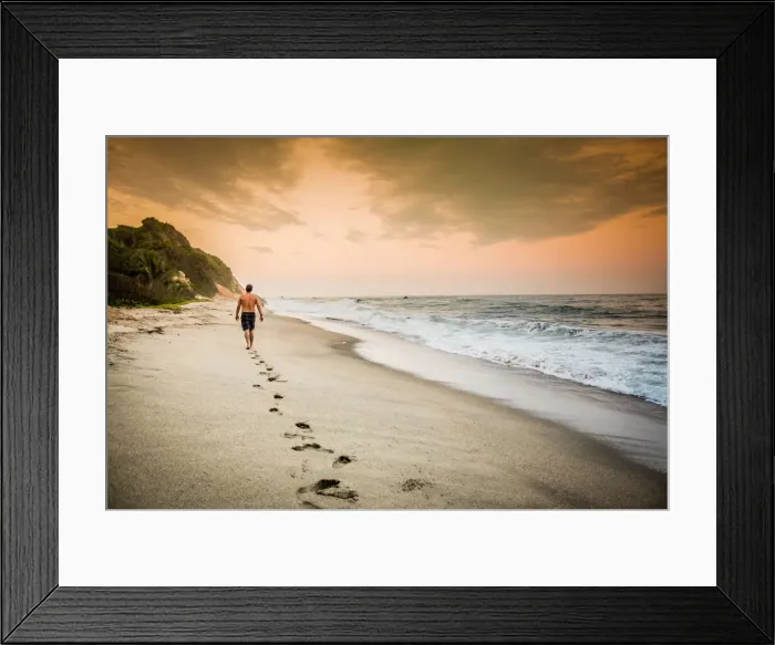 Framed Print : Man walking on the beach in Tayrona National Park, Colombia, South America Framed Print : Man walking on the beach in Tayrona National Park, Colombia, South America
