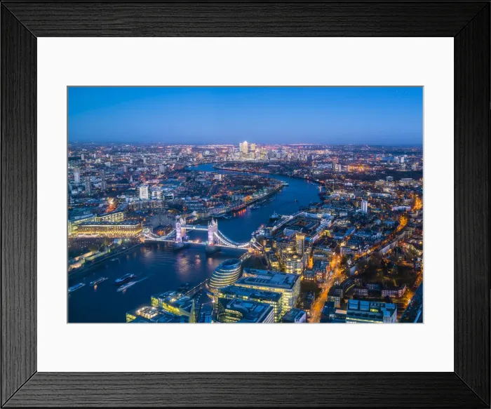 Framed Print : High view of London skyline at dusk along the River Thames from Tower Bridge to Canary Wharf Framed Print : High view of London skyline at dusk along the River Thames from Tower Bridge to Canary Wharf