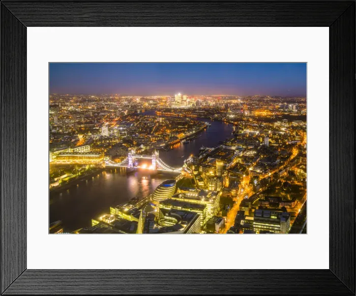 Framed Print : High view of London skyline at night along the River Thames from Tower Bridge to Canary Wharf Framed Print : High view of London skyline at night along the River Thames from Tower Bridge to Canary Wharf
