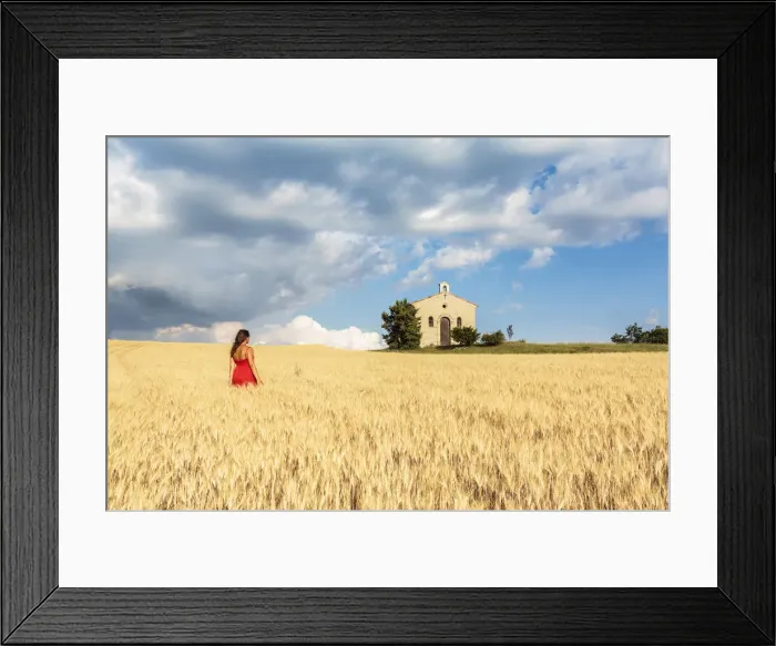 Framed Print : Woman in red dress admiring Notre-Dame-de-Sante chapel in a wheat field, Entrevennes Framed Print : Woman in red dress admiring Notre-Dame-de-Sante chapel in a wheat field, Entrevennes