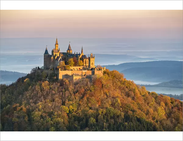 Hohenzollern castle in autumnal scenery at dawn, Hechingen, Baden-Wurttemberg, Germany
