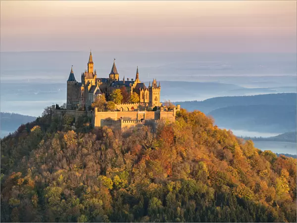 Hohenzollern castle in autumnal scenery at dawn, Hechingen, Baden-Wurttemberg, Germany